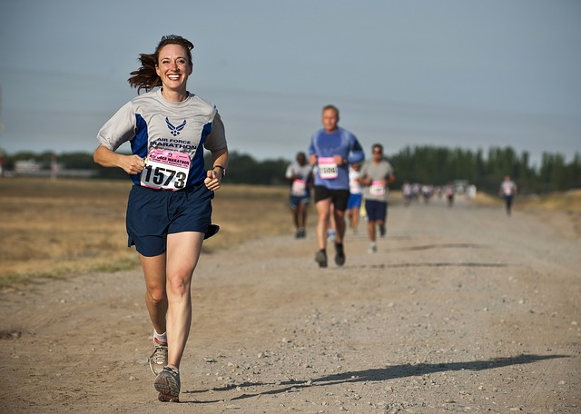 runner running a race, woman smiling